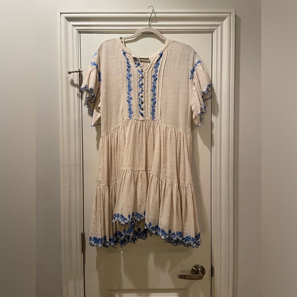 Cream and blue free people dress with floral trim and bottom details